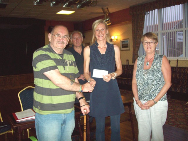 League President Derek Overton presents a cheque from the League for £750 to Barbara Harrison for the Neonatal Unit at North Tees Hospital